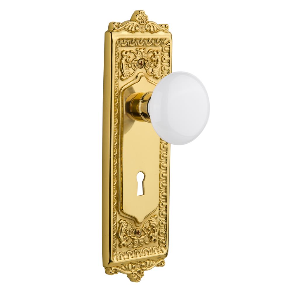 Nostalgic Warehouse EADWHI Mortise Egg and Dart Plate with White Porcelain Knob and Keyhole in Polished Brass